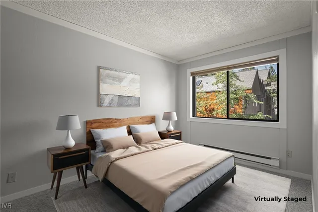 a bedroom with a bed and window