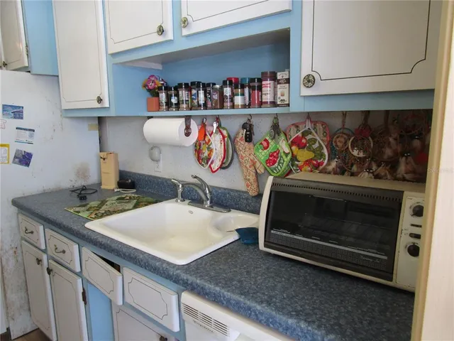 a kitchen with a stove and cabinets