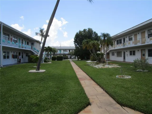 a view of a building with a yard