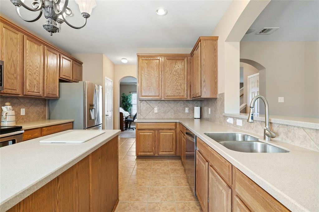 2603 White Stallion Way Leander, TX 78641 - Photo 16 of 38 a kitchen with a sink cabinets and appliances