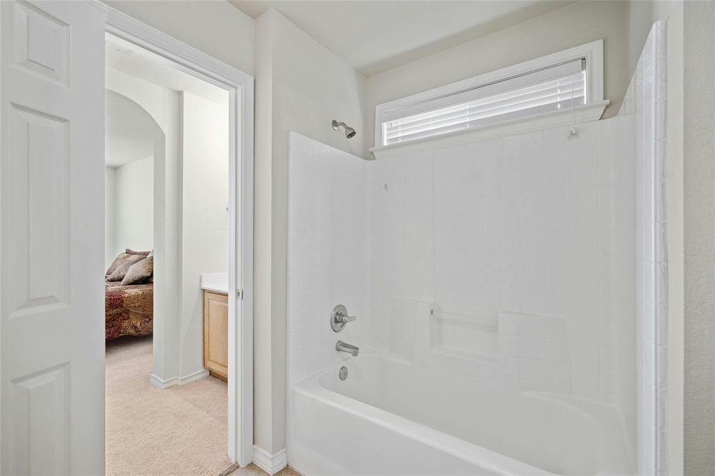 2603 White Stallion Way Leander, TX 78641 - Photo 25 of 38 a bathroom with a tub and shower