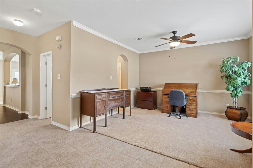2603 White Stallion Way Leander, TX 78641 - Photo 6 of 38 a view of a livingroom with furniture and a ceiling fan