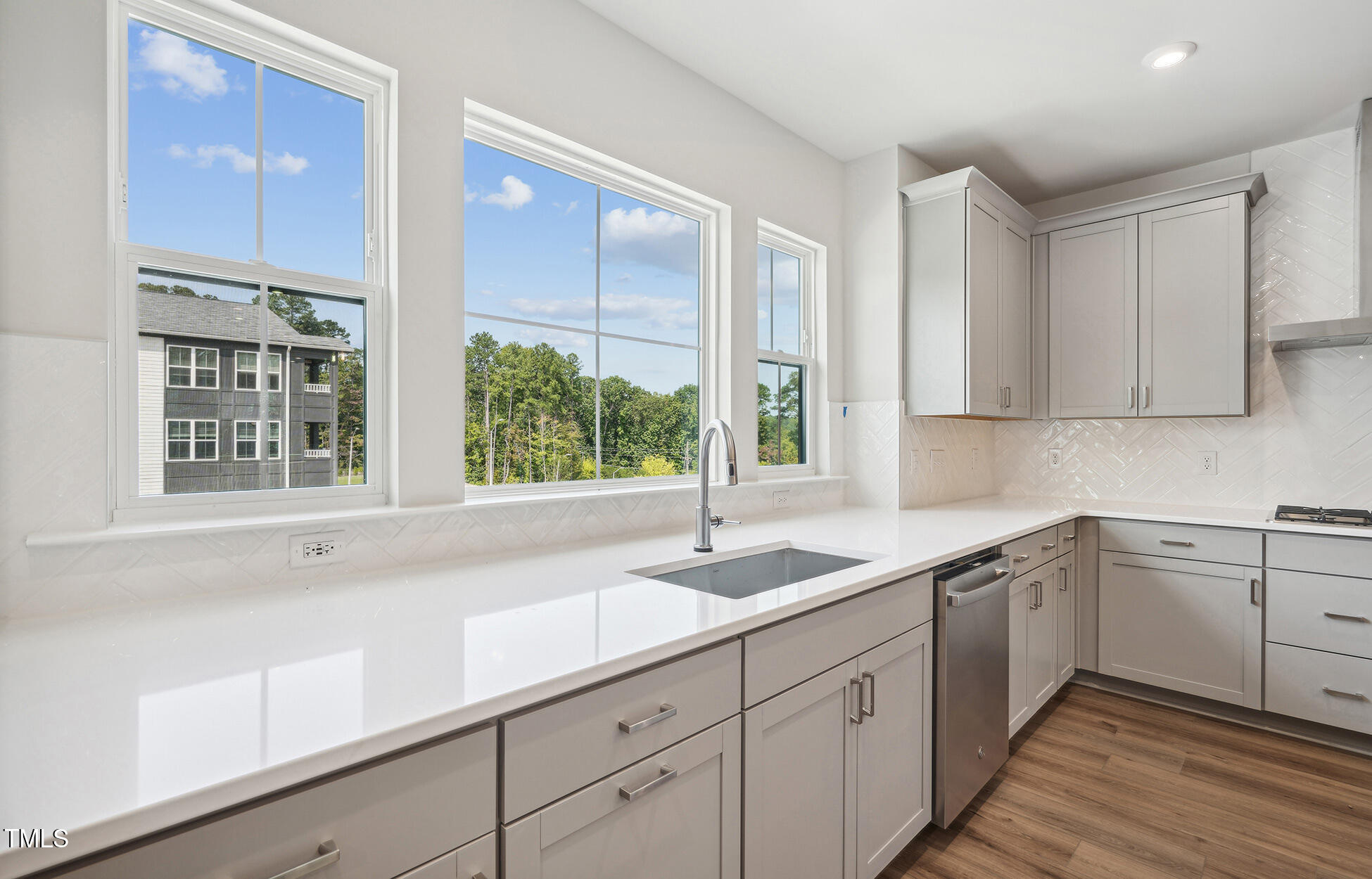 4816 Cypress Tree Lane Raleigh, NC 27612 - Photo 6 of 15 a kitchen with sink and window