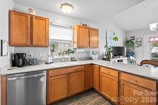 a kitchen with sink cabinets and a window