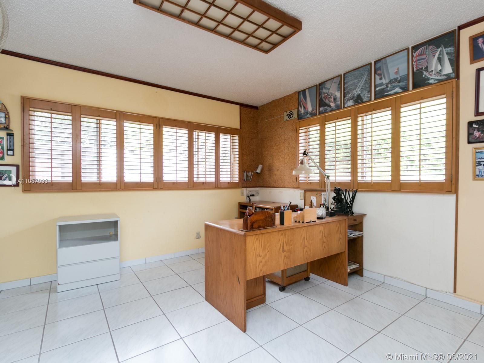 4708 Alton Road Miami Beach, FL 33140 - Photo 13 of 38 a room with furniture and window