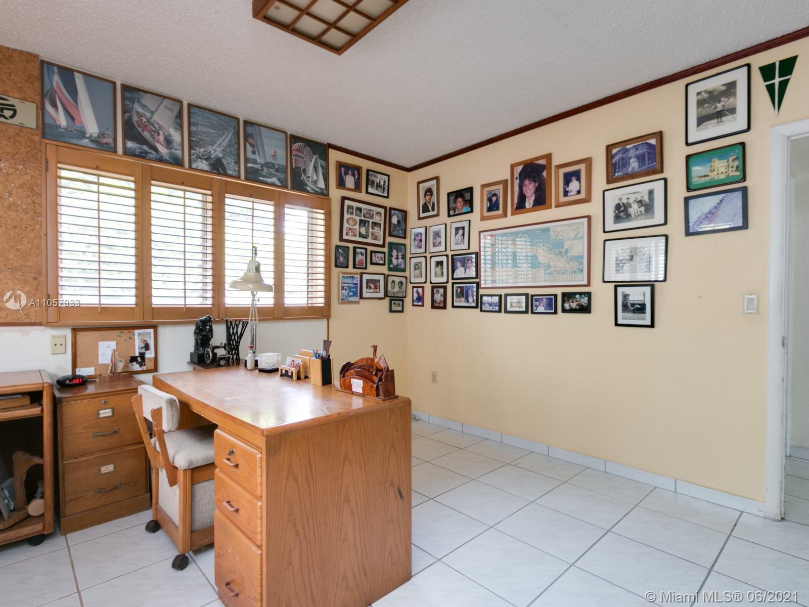 4708 Alton Road Miami Beach, FL 33140 - Photo 14 of 38 a room with a workspace and a window