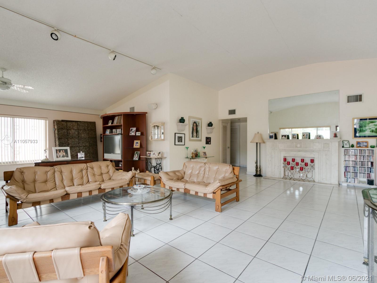 4708 Alton Road Miami Beach, FL 33140 - Photo 24 of 38 a living room with furniture and a couch