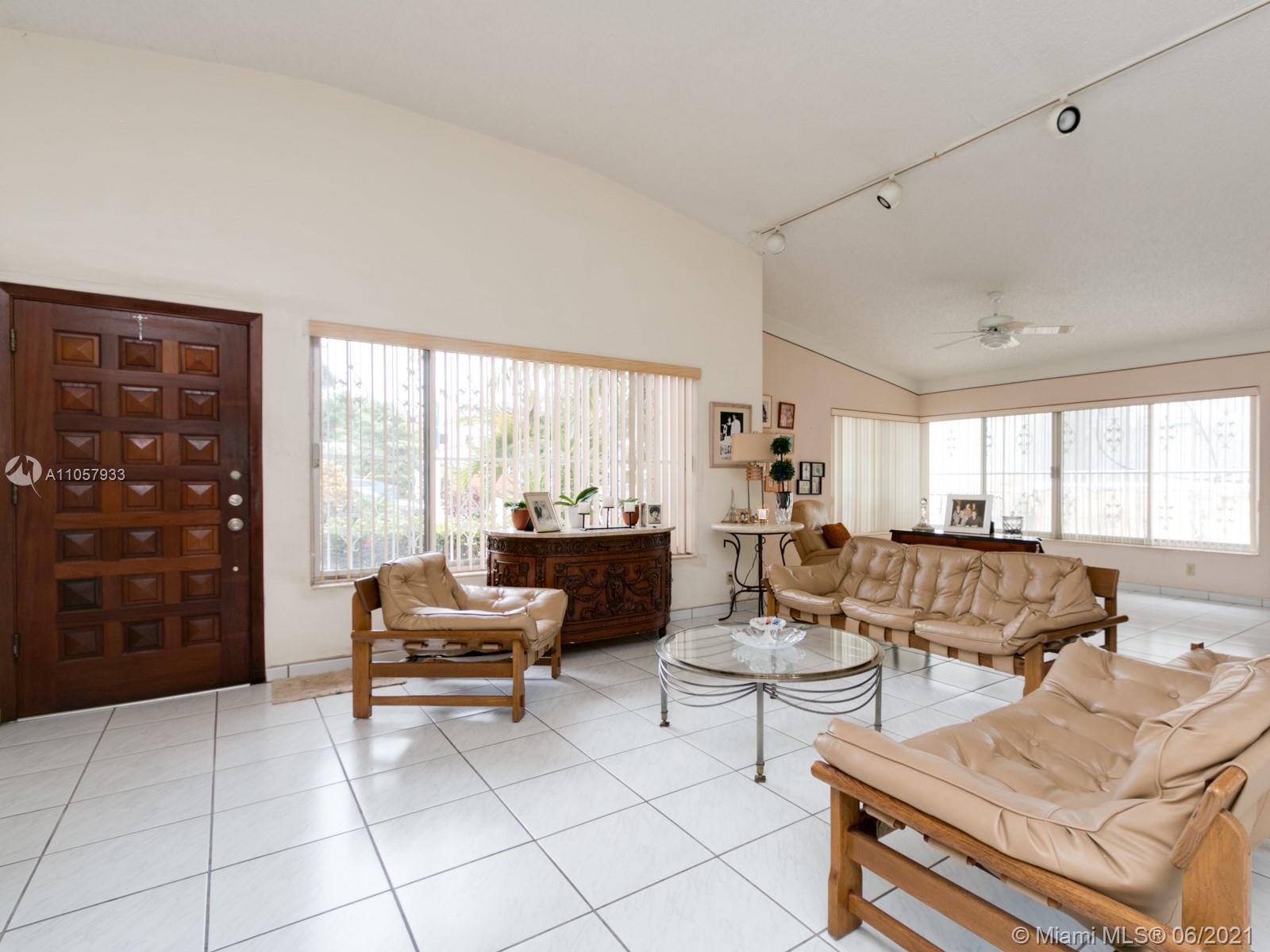 4708 Alton Road Miami Beach, FL 33140 - Photo 25 of 38 a living room with furniture and a large window