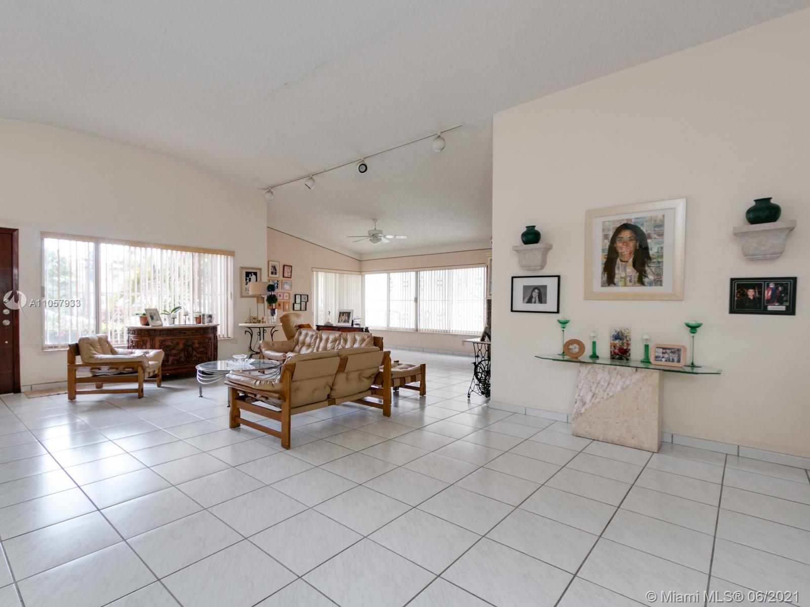 4708 Alton Road Miami Beach, FL 33140 - Photo 33 of 38 a living room with furniture and a large window