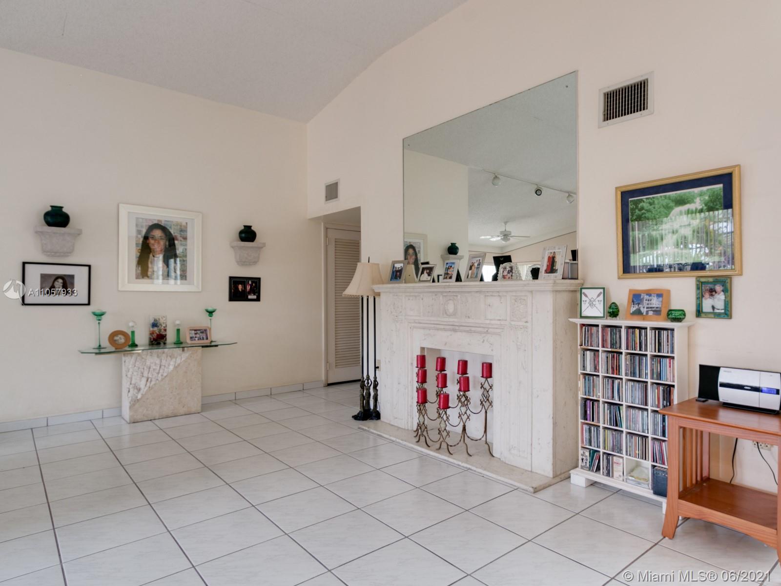 4708 Alton Road Miami Beach, FL 33140 - Photo 34 of 38 a living room with furniture cabinets and window