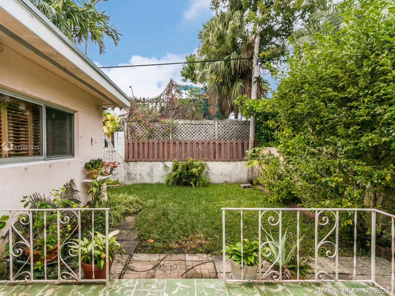 4708 Alton Road Miami Beach, FL 33140 - Photo 37 of 38 a view of a chair and table in the patio