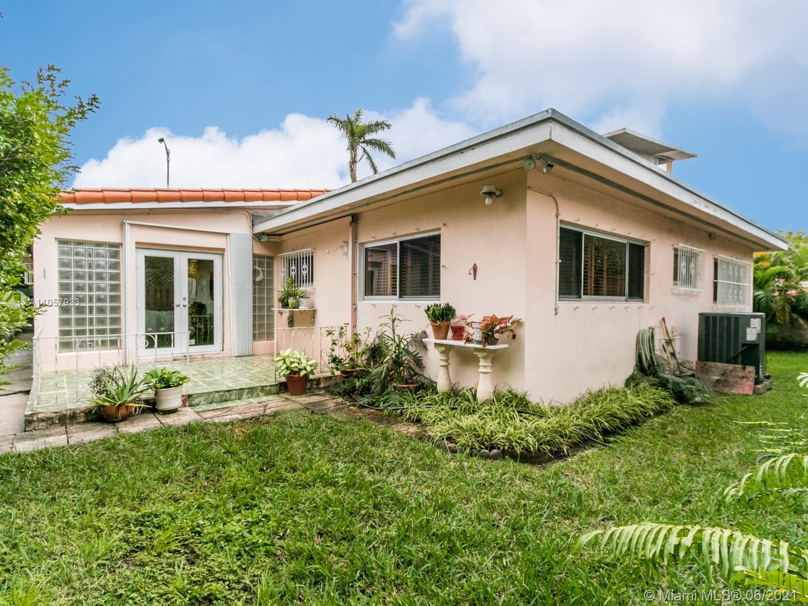 4708 Alton Road Miami Beach, FL 33140 - Photo 38 of 38 a view of a house with backyard and garden