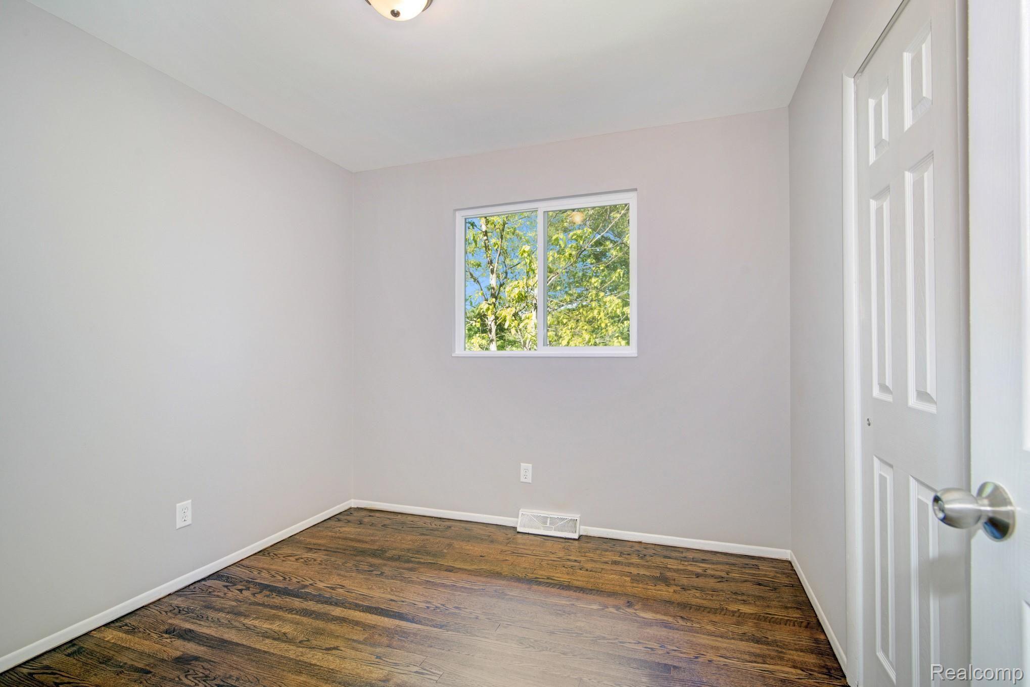 3680 North Gregory Road Fowlerville, MI 48836 - Photo 15 of 24 Bedroom 2 has hardwood flooring