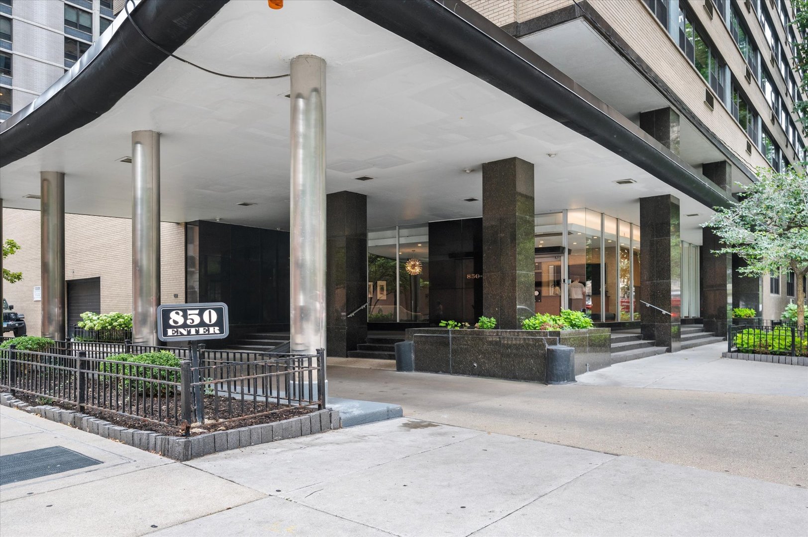 850 North Dewitt Place, Unit 4G Chicago, IL 60611 - Photo 2 of 18 a building exterior with furniture