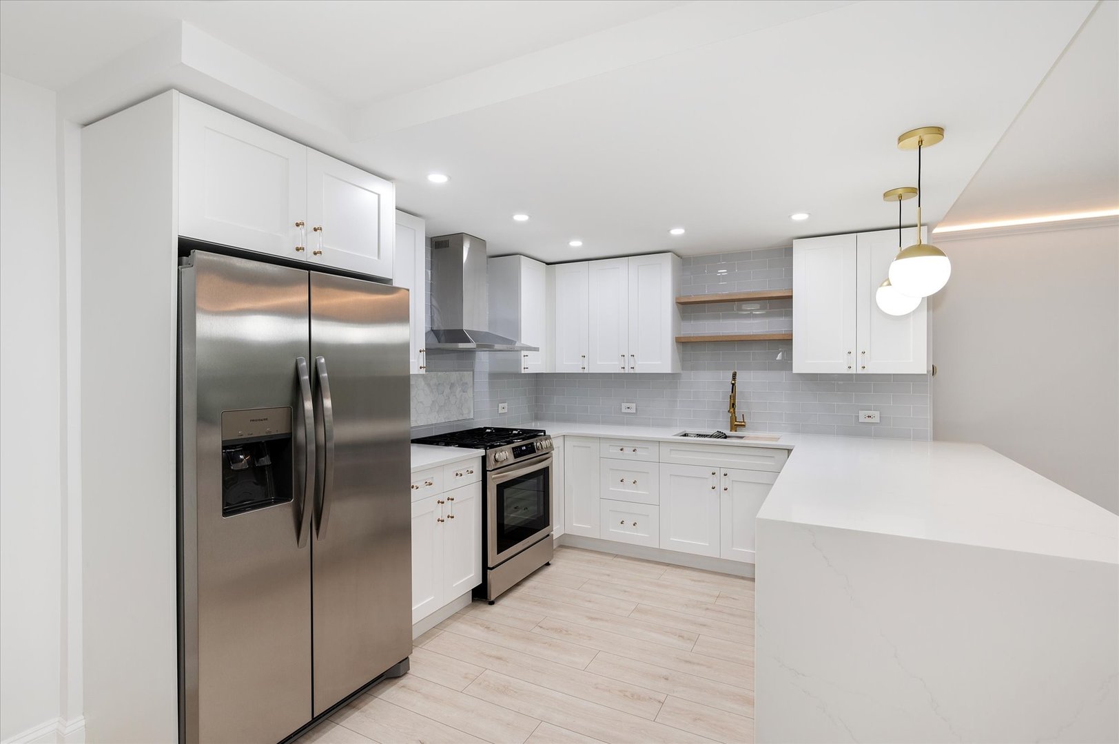 850 North Dewitt Place, Unit 4G Chicago, IL 60611 - Photo 3 of 18 a kitchen with a refrigerator a sink and cabinets