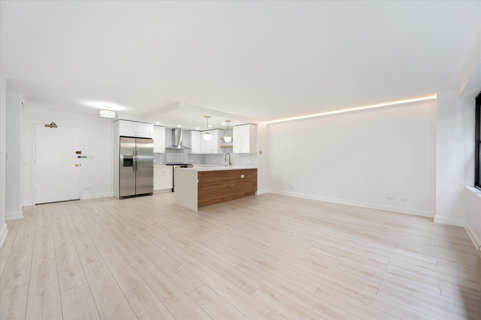 850 North Dewitt Place, Unit 4G Chicago, IL 60611 - Photo 6 of 18 a view of a kitchen with wooden floor