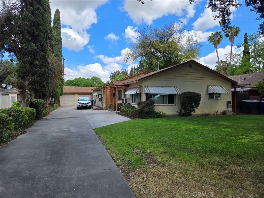 7457 Mt Vernon Street Riverside, CA 92504 - Photo 1 of 23 a view of a house with backyard and garden