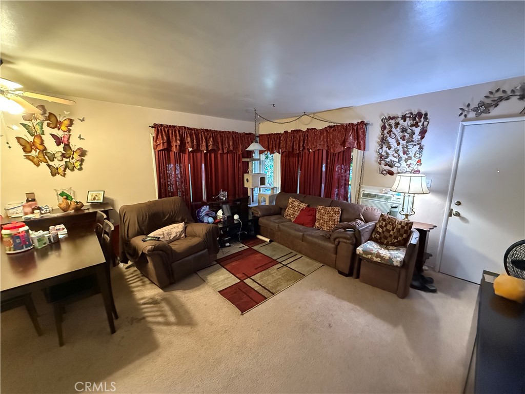 7457 Mt Vernon Street Riverside, CA 92504 - Photo 16 of 23 a living room with furniture and a couch