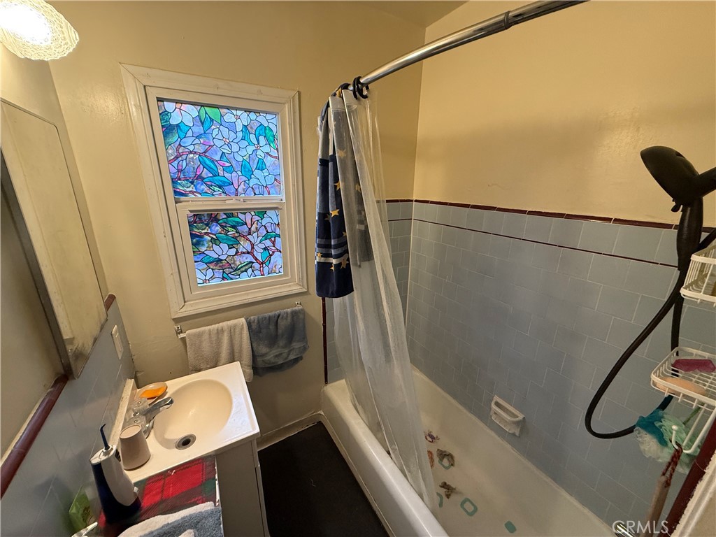 7457 Mt Vernon Street Riverside, CA 92504 - Photo 20 of 23 a bathroom with a sink and a shower