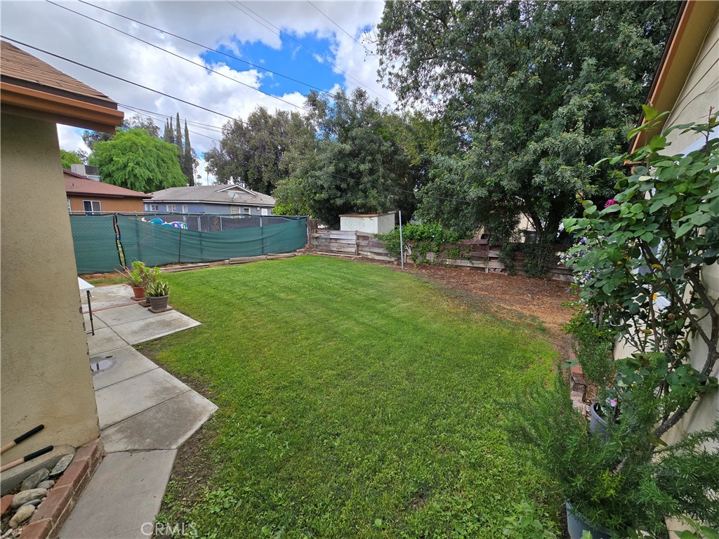 7457 Mt Vernon Street Riverside, CA 92504 - Photo 3 of 23 a view of a backyard with a garden