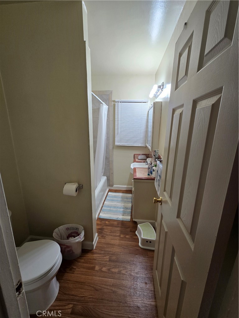 7457 Mt Vernon Street Riverside, CA 92504 - Photo 8 of 23 a bathroom with a sink toilet and shower