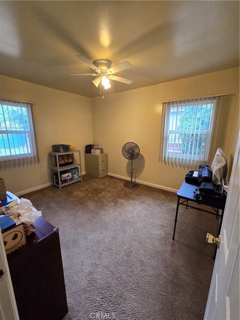 7457 Mt Vernon Street Riverside, CA 92504 - Photo 10 of 23 a livingroom with furniture and a window