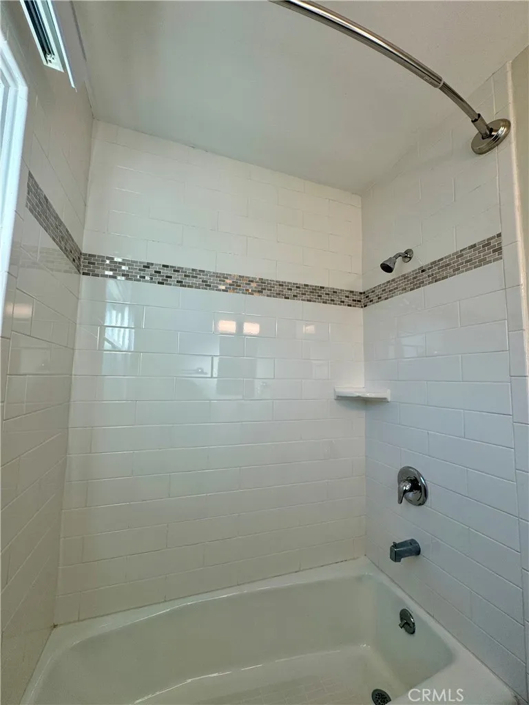 3402 Gaviota Avenue, Unit B Long Beach, CA 90807 - Photo 15 of 22 a bathroom with a bath tub and a shower