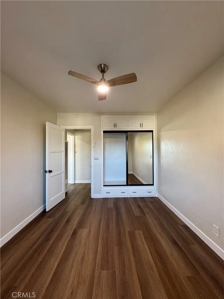 3402 Gaviota Avenue, Unit B Long Beach, CA 90807 - Photo 17 of 22 a view of an empty room with wooden floor and a window