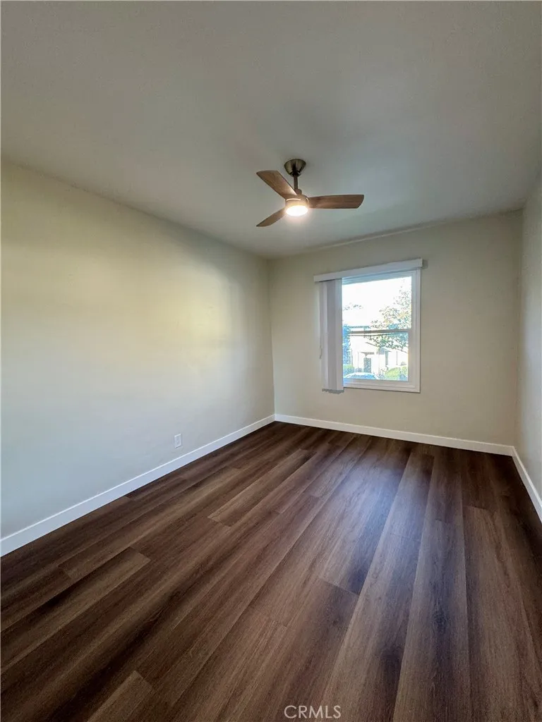 3402 Gaviota Avenue, Unit B Long Beach, CA 90807 - Photo 18 of 22 an empty room with wooden floor and windows