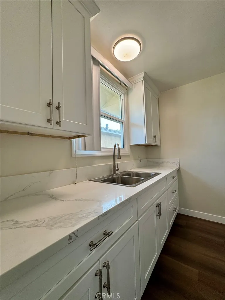 3402 Gaviota Avenue, Unit B Long Beach, CA 90807 - Photo 8 of 22 a kitchen with sink and cabinets