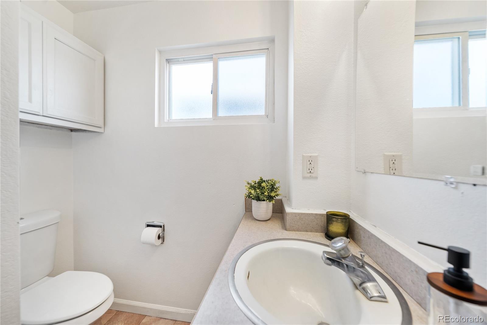 550 Custer Avenue Akron, CO 80720 - Photo 19 of 35 a bathroom with a sink and a toilet