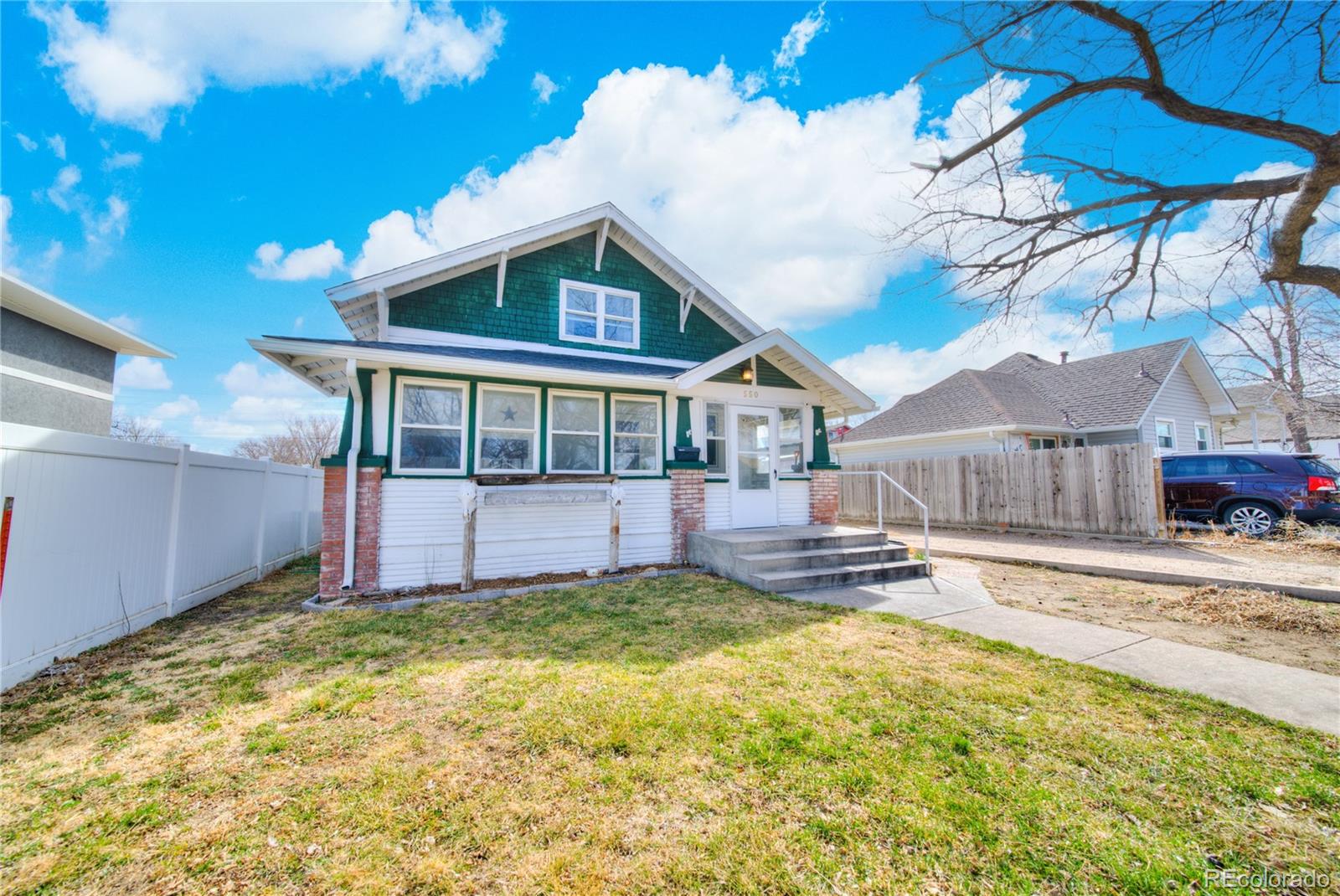 550 Custer Avenue Akron, CO 80720 - Photo 6 of 35 a view of a house with a yard and sitting area