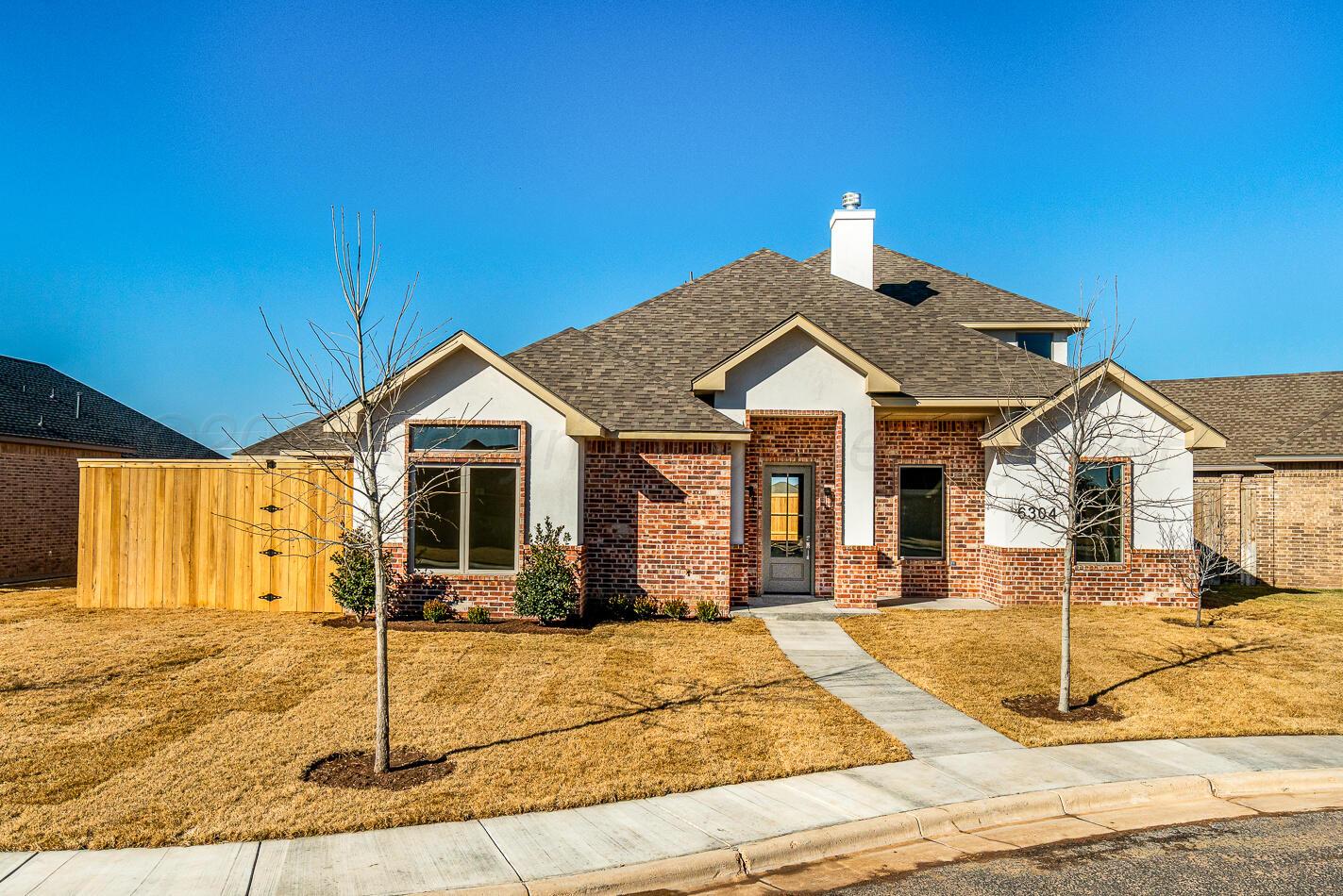 a view of a house with small yard