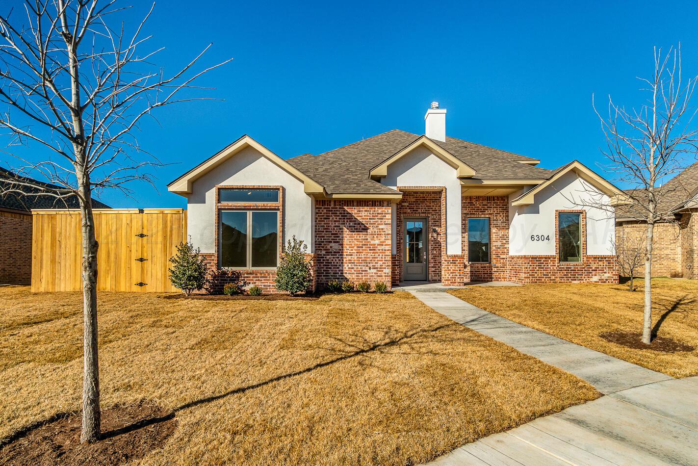 6304 Lauren Ashleigh Drive Amarillo, TX 79119 - Photo 2 of 38 a front view of a house with patio