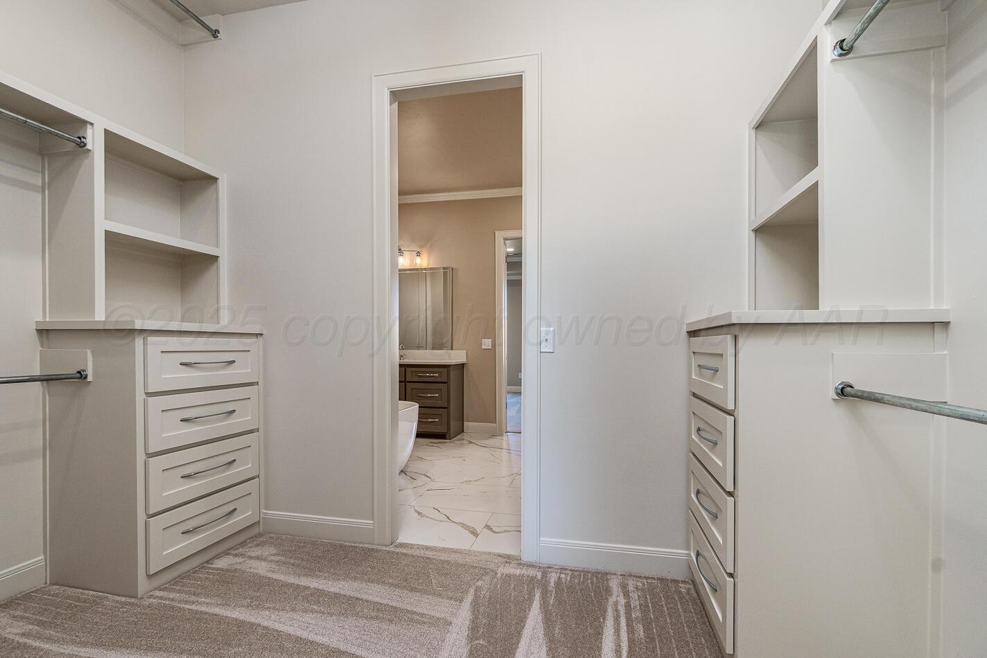 6304 Lauren Ashleigh Drive Amarillo, TX 79119 - Photo 22 of 38 a view of walk in closet with empty racks