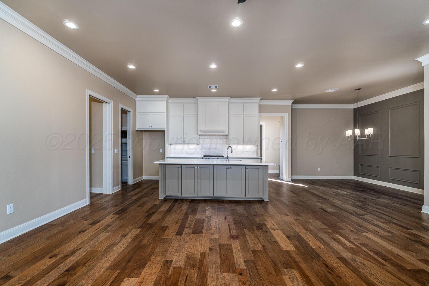 6304 Lauren Ashleigh Drive Amarillo, TX 79119 - Photo 8 of 38 a large kitchen with a lot of counter space and stainless steel appliances