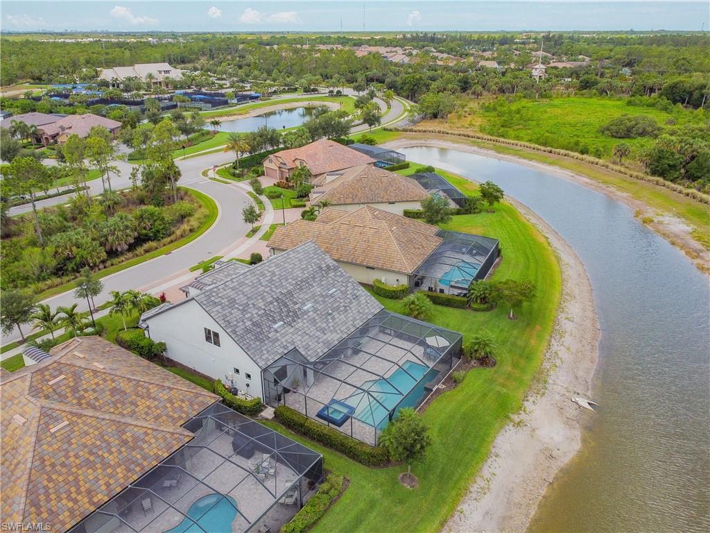 an aerial view of a house with a ocean view