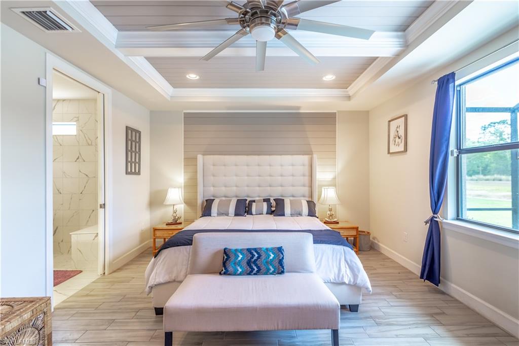 7247 Clamshell Lane Naples, FL 34114 - Photo 15 of 33 a bedroom with a bed and window