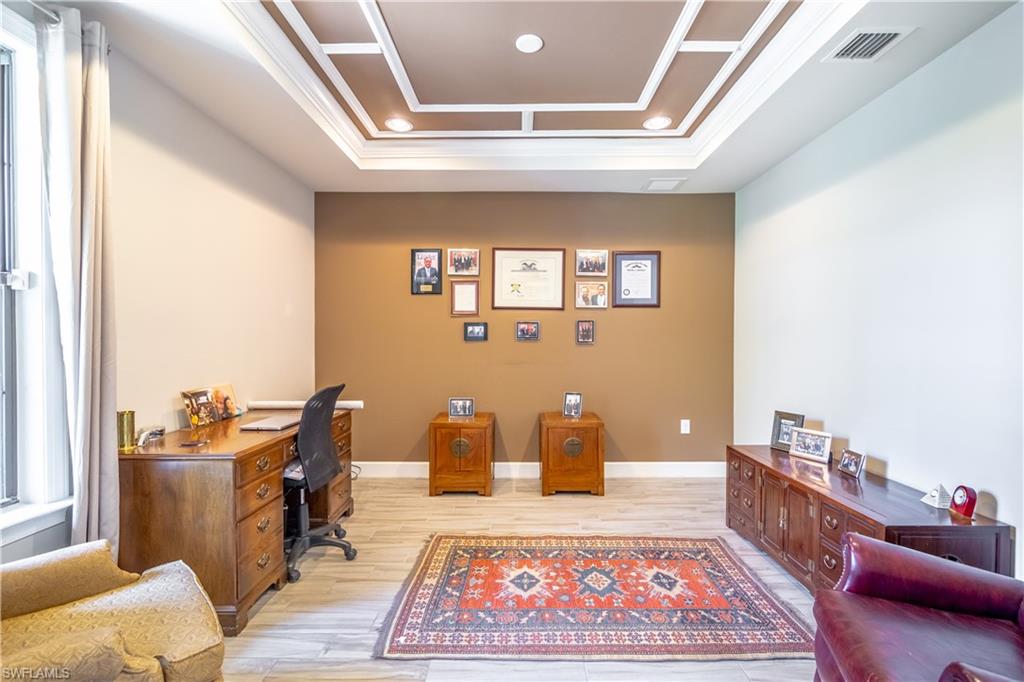 7247 Clamshell Lane Naples, FL 34114 - Photo 19 of 33 a living room with furniture and a rug