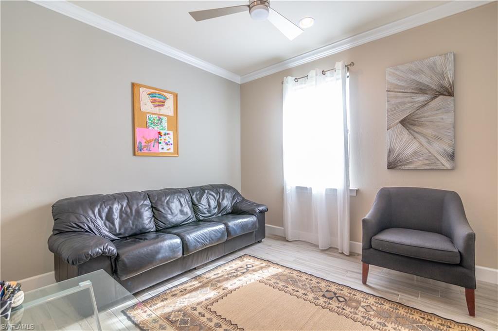 7247 Clamshell Lane Naples, FL 34114 - Photo 21 of 33 a living room with furniture and a couch