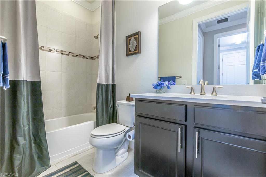 7247 Clamshell Lane Naples, FL 34114 - Photo 24 of 33 a bathroom with a sink toilet and shower