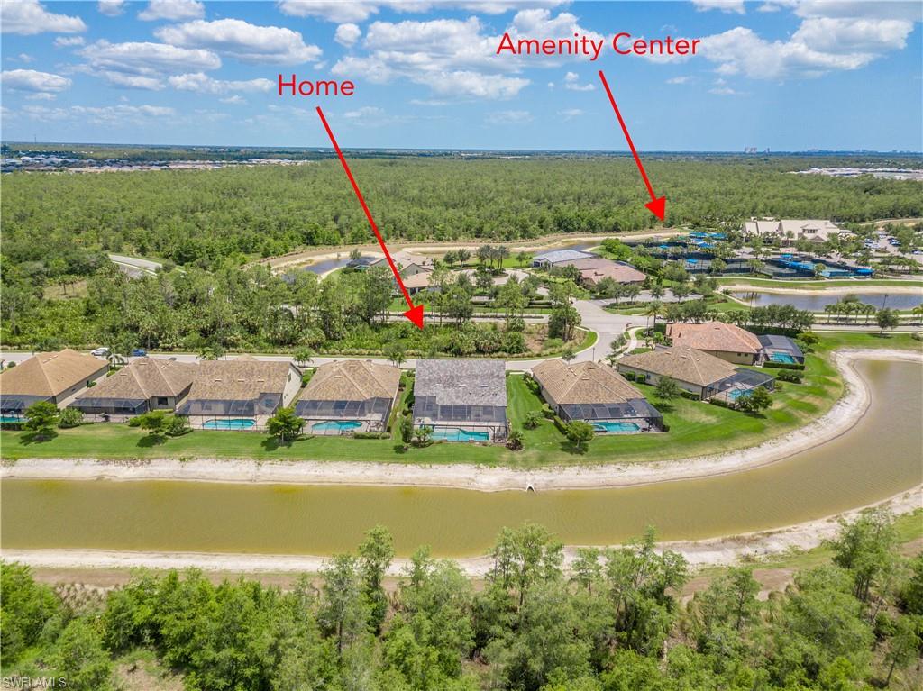 7247 Clamshell Lane Naples, FL 34114 - Photo 25 of 33 a view of a lake with a ocean view