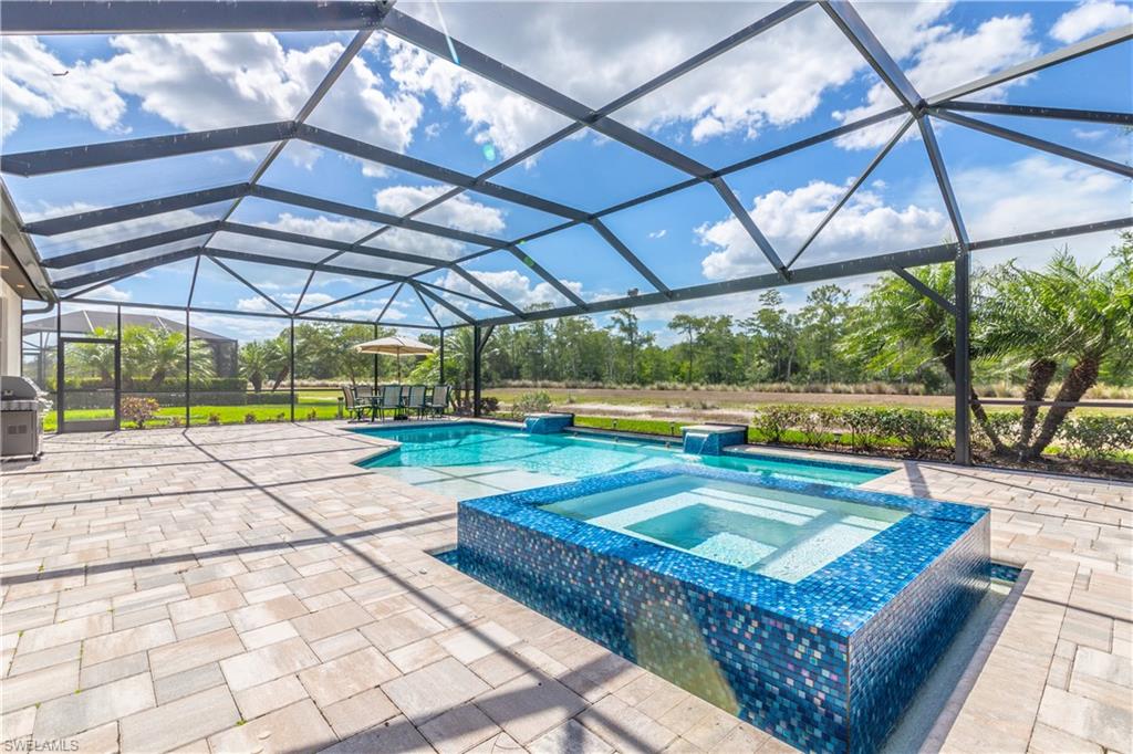 7247 Clamshell Lane Naples, FL 34114 - Photo 5 of 33 a view of swimming pool with a patio