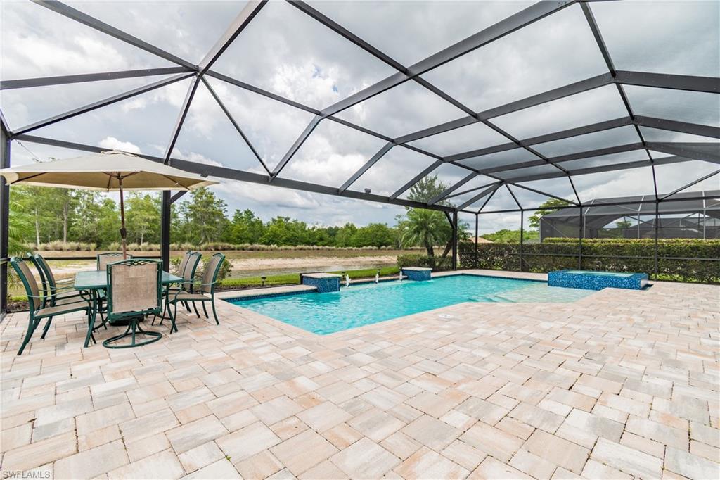 7247 Clamshell Lane Naples, FL 34114 - Photo 6 of 33 a view of a swimming pool with a porch