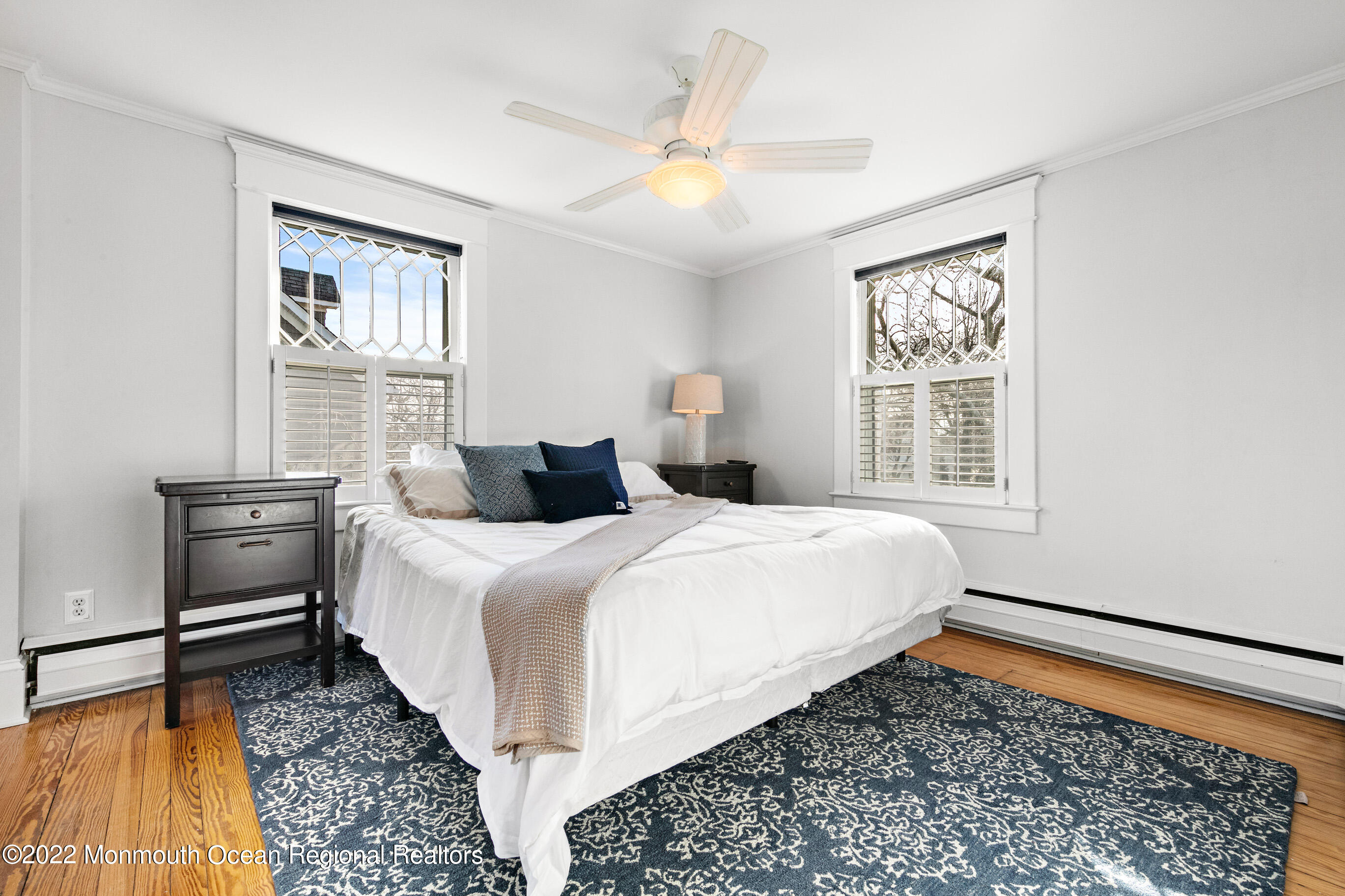 116 Tuttle Avenue, Unit WINTER 20232024 Spring Lake, NJ 07762 - Photo 25 of 44 a bedroom with a bed and a window