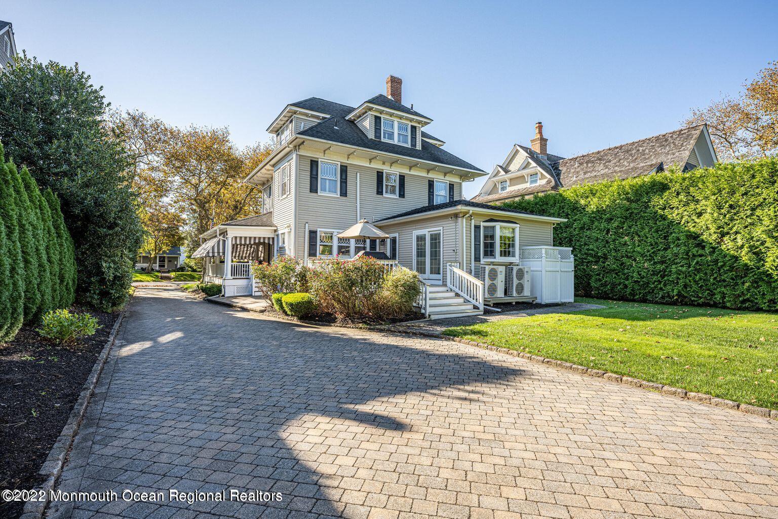 116 Tuttle Avenue, Unit WINTER 20232024 Spring Lake, NJ 07762 - Photo 38 of 44 a front view of a house with a yard