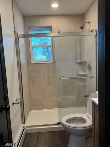 a bathroom with a shower and a toilet