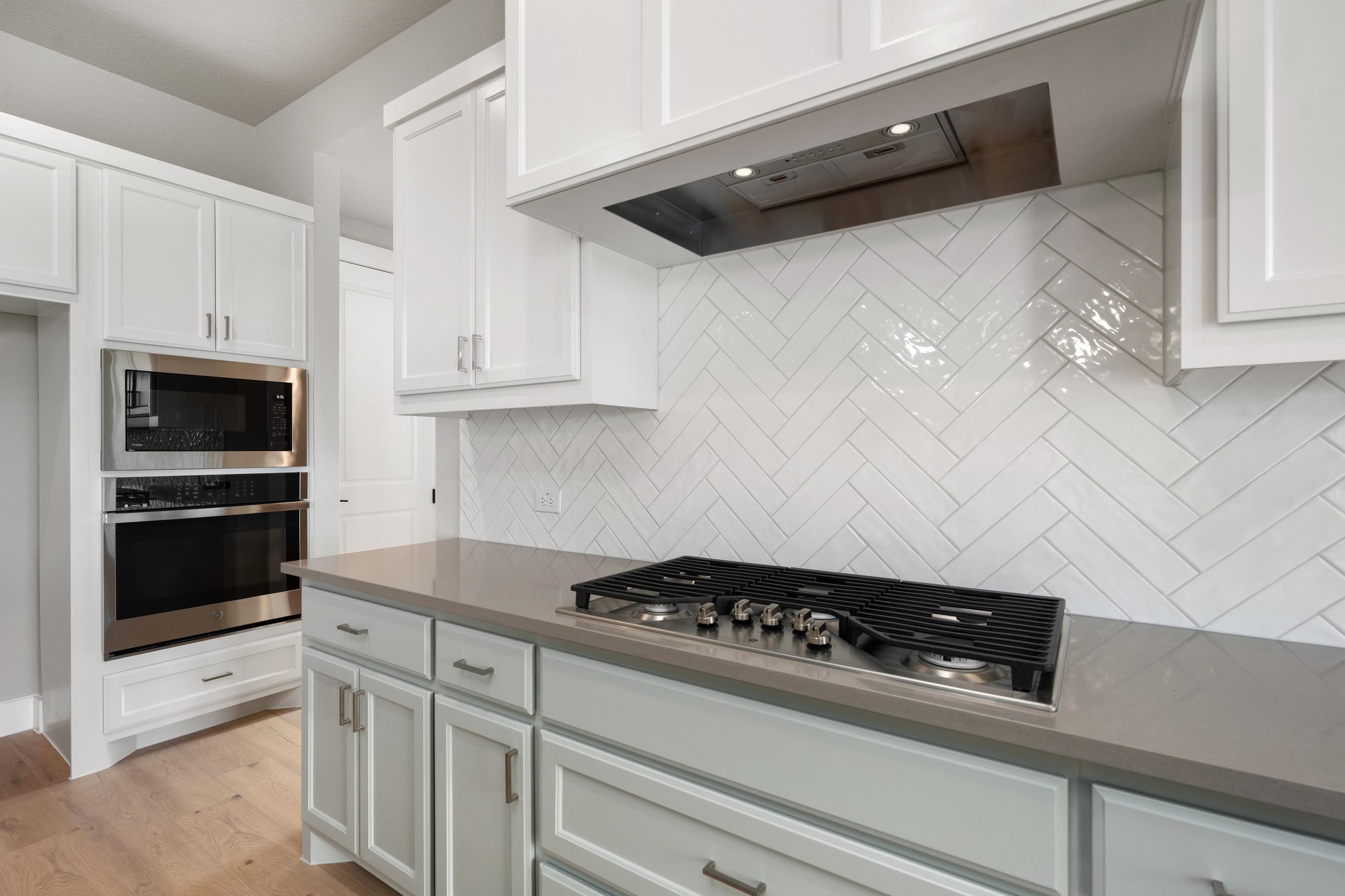103 Buck Rabbit Road Lampasas, TX 76550 - Photo 13 of 29 a kitchen with a stove and a microwave