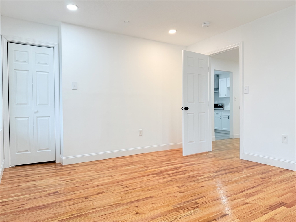 23 Bellevue Street, Unit 3 Worcester, MA 01609 - Photo 8 of 26 a view of an empty room with wooden floor