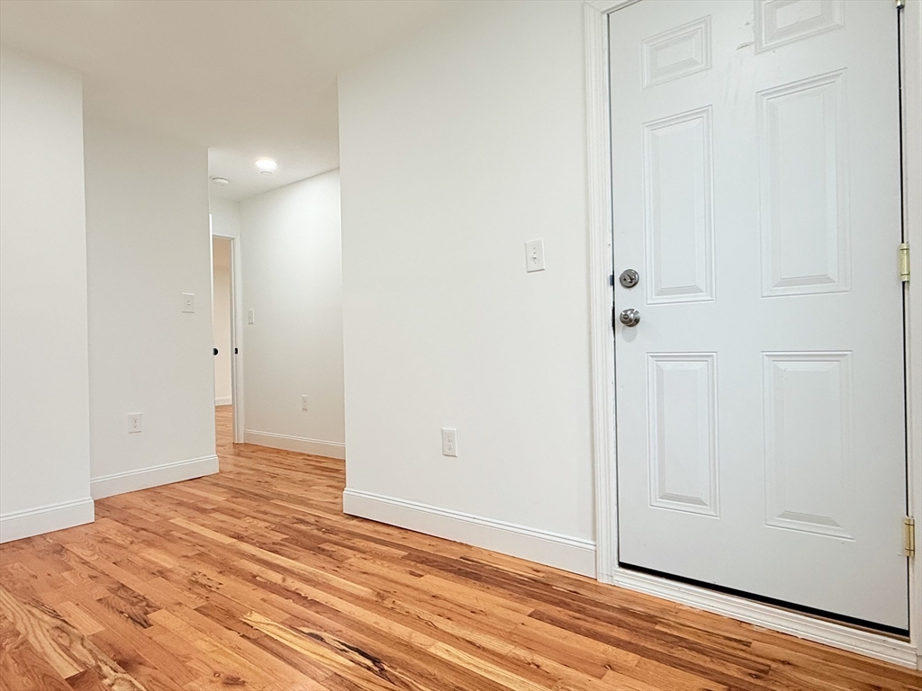 23 Bellevue Street, Unit 3 Worcester, MA 01609 - Photo 9 of 26 wooden floor in an empty room